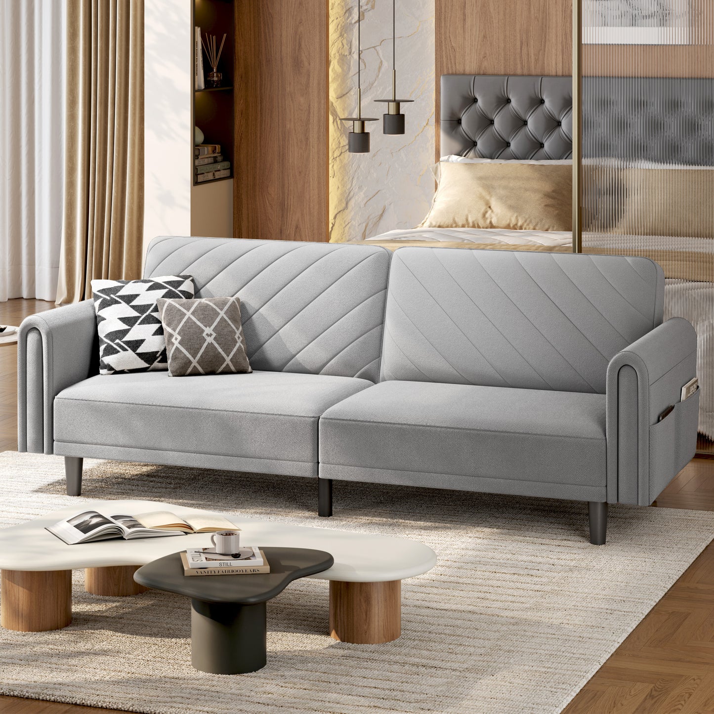 Gray sectional sofa in a living room setting with coffee table and decor.